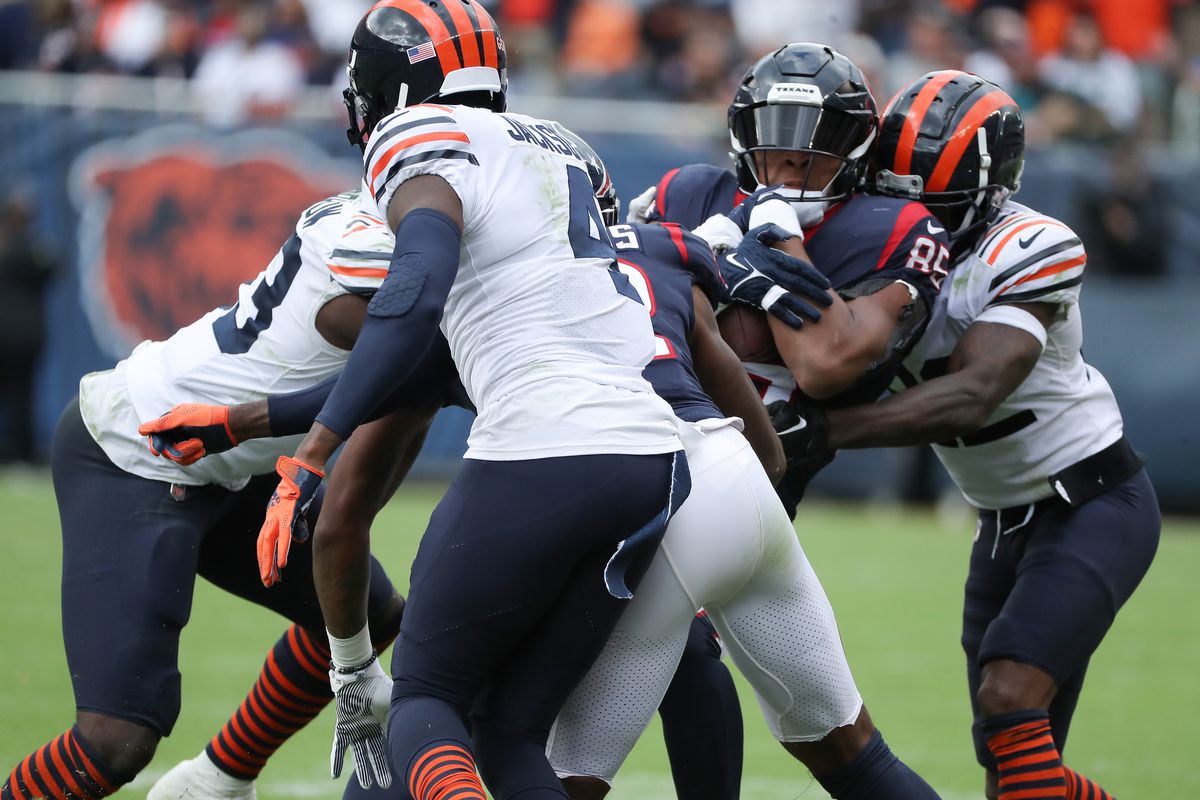 Houston Texans tight end Pharaoh Brown is tackled after making a catch during a game between the Houston Texans and the Chicago Bears on September 25, 2022 at Soldier Field in Chicago, IL.