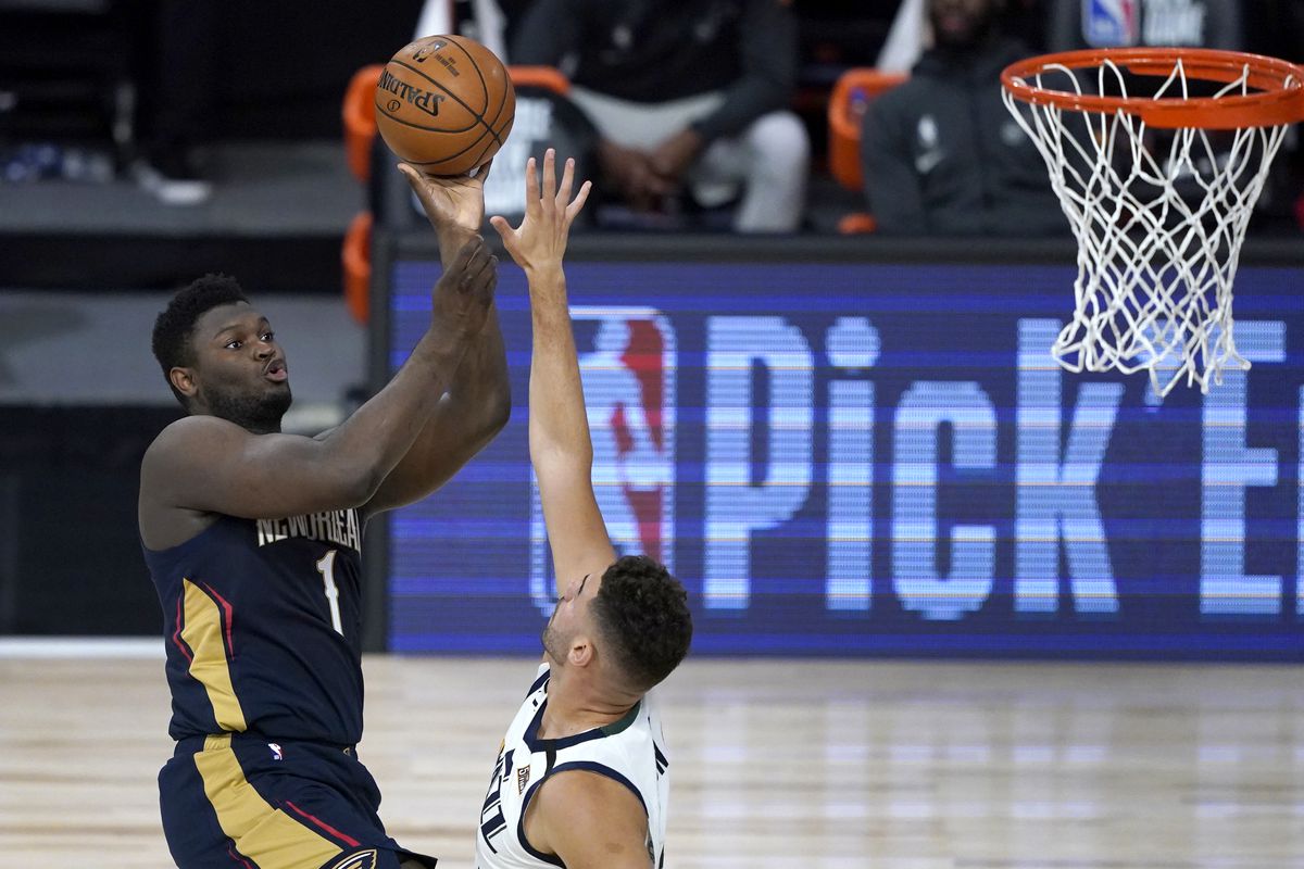 Zion Williamson of the New Orleans Pelicans shoots over Georges Niang of the Utah Jazz during the first half at HP Field House at ESPN Wide World Of Sports Complex on July 30, 2020 in Reunion, Florida.&nbsp;