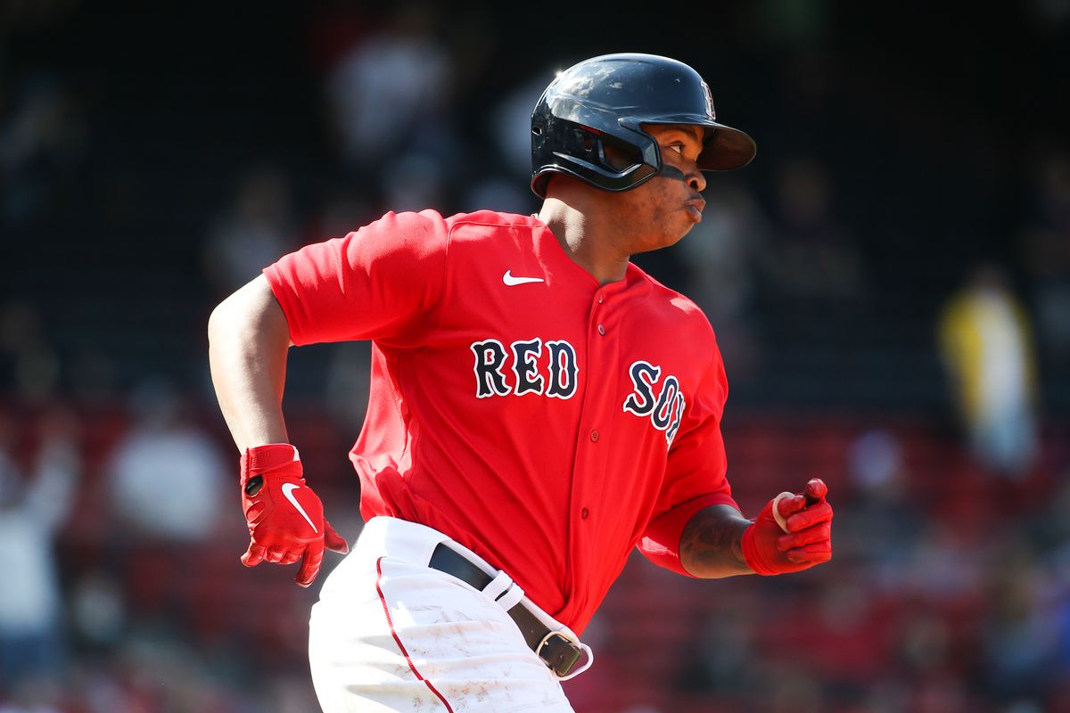 Rafael Devers #11 of the Boston Red Sox runs the bases after hitting a double in the seventh inning against the Seattle Mariners at Fenway Park on April 24, 2021 in Boston, Massachusetts.