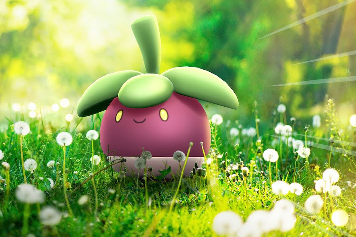 A Bounsweet dramatically sits on a grassy floor in Pokémon Go