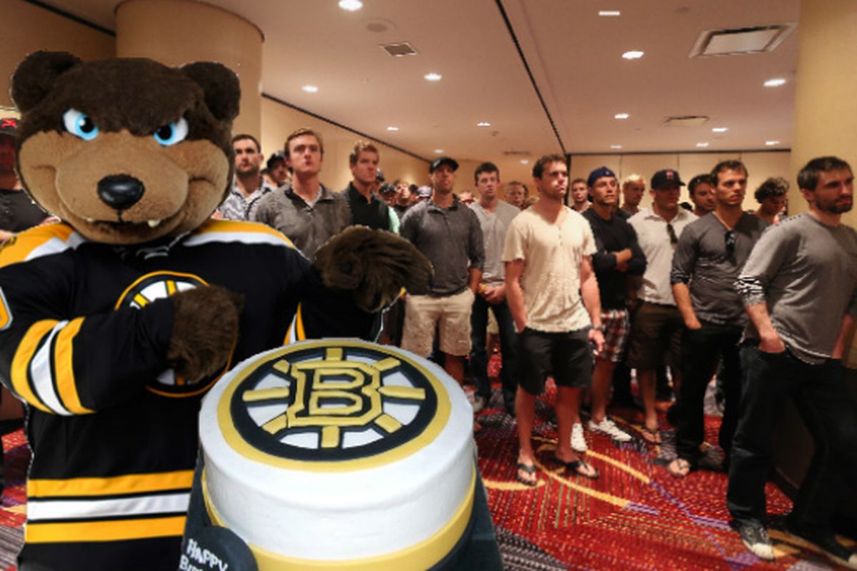 Exclusive Photo of NHL players and Bruins mascot Blades the Bear awaiting the arrival of the birthday boy, Jeremy Jacobs