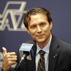 Quin Snyder gestures after being introduced as the new Utah Jazz head coach during an NBA basketball news conference Saturday, June 7, 2014, in Salt Lake City. The Jazz announced Friday that they hired the Atlanta Hawks assistant coach to replace Tyrone Corbin, who was let go earlier this year after three-plus seasons in Salt Lake City.  (AP Photo/Rick Bowmer)