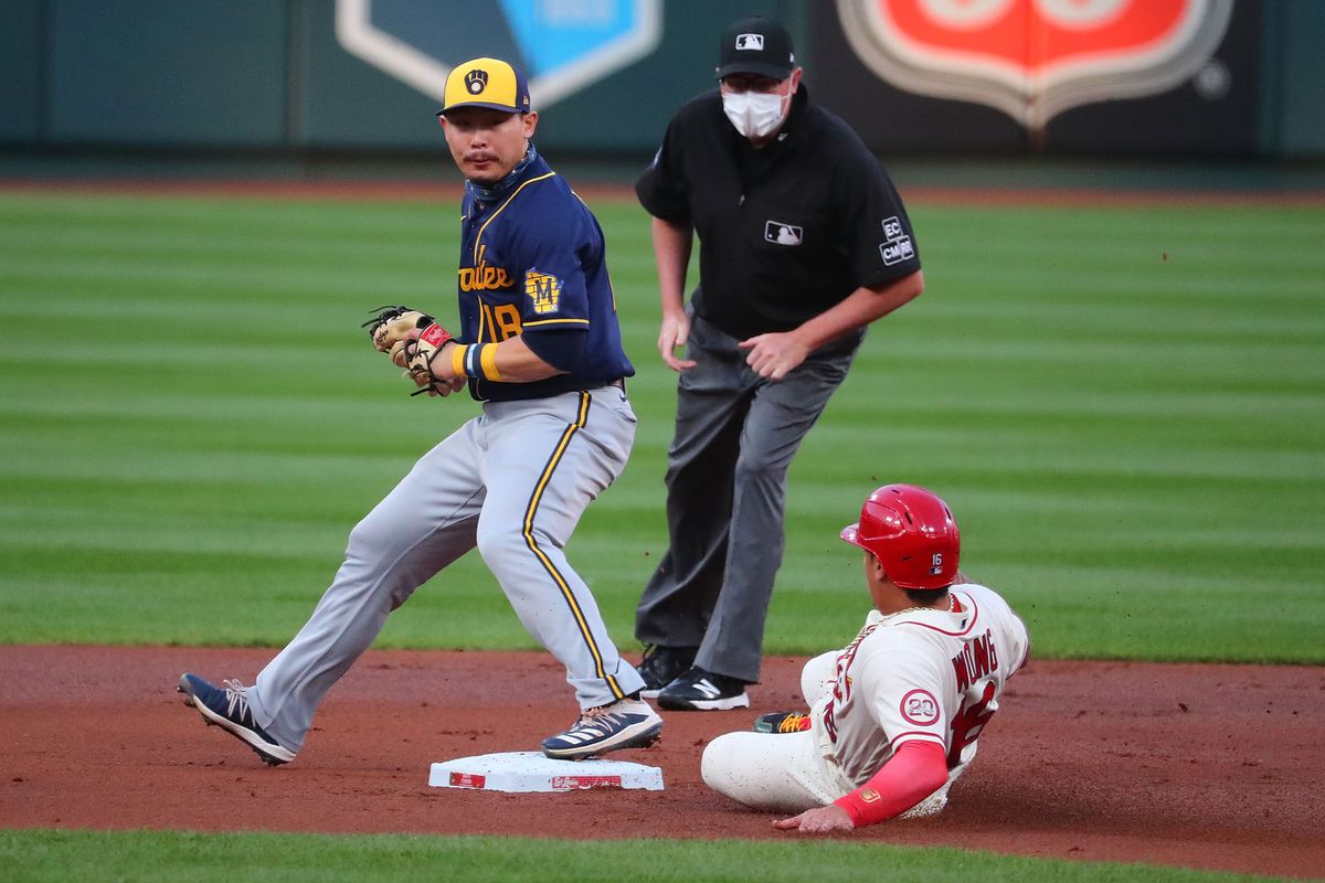 Keston Hiura of the Milwaukee Brewers beats Kolten Wong of the St. Louis Cardinals to second base for a force out in the first inning at Busch Stadium on September 26, 2020 in St Louis, Missouri.