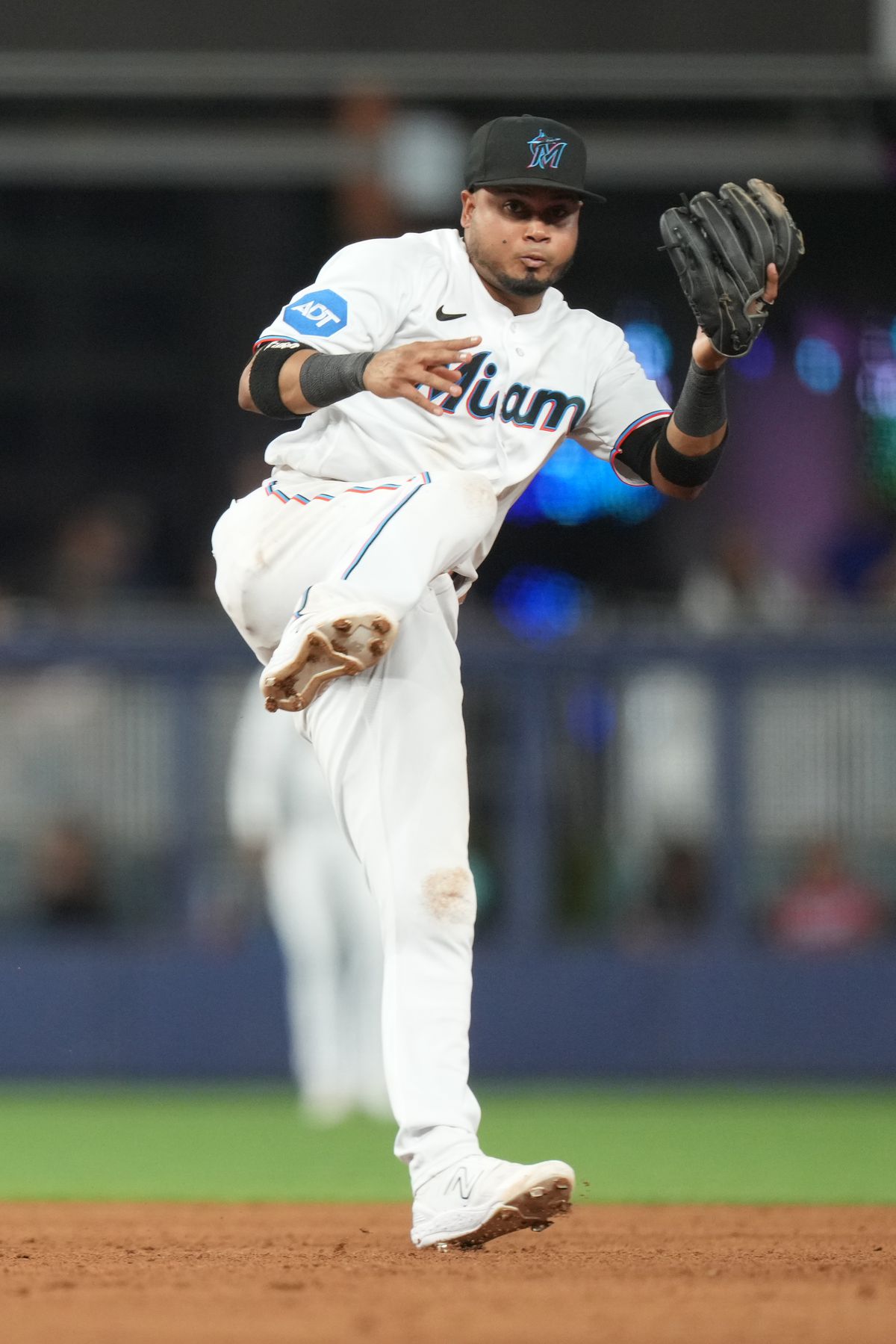 Miami Marlins second baseman Luis Arraez (3) makes an off balance throw to first base during the game between the Atlanta Braves and the Miami Marlins on Tuesday, May 2, 2023 at LoanDepot Park in Miami, Fla.