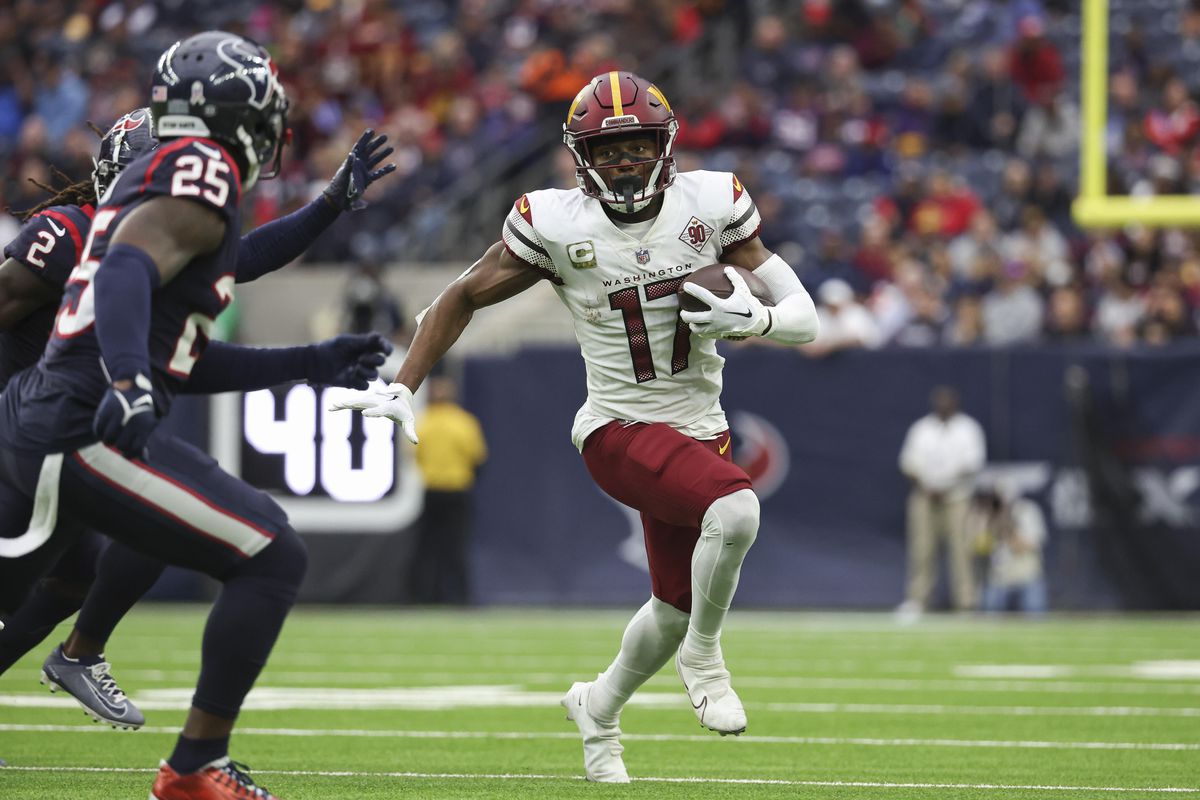 Washington Commanders wide receiver Terry McLaurin (17) runs with the ball during the second quarter against the Houston Texans at NRG Stadium