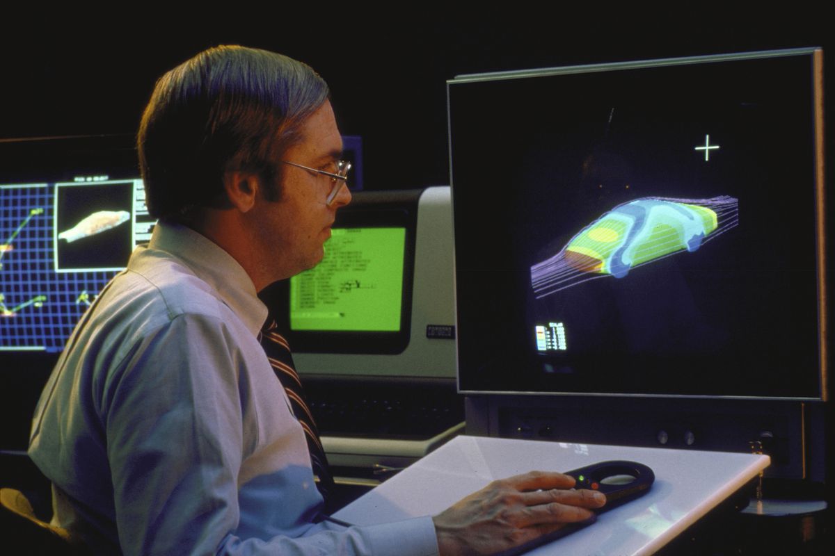 General Motors employee working at new Gray 1-S/2000 supercomputer which simulates appearance and aerodynamics of new car designs at research labs.