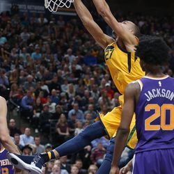 Utah Jazz center Rudy Gobert (27) dunks on Phoenix Suns guard Josh Jackson (20)  in Salt Lake City on Thursday, March 15, 2018. The Jazz 116-88.