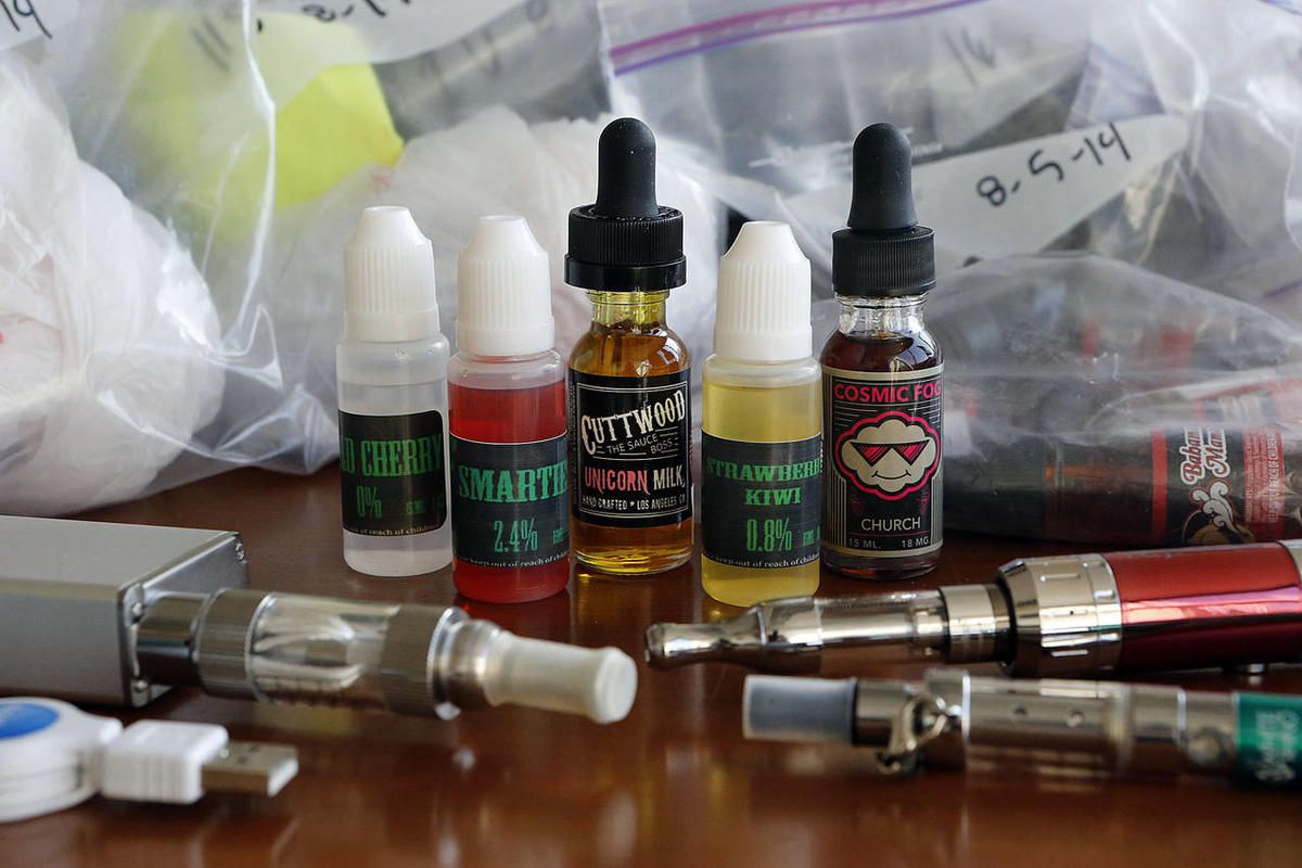 A few of 153 samples of e-juice, used in e-cigarettes, are displayed at the Salt Lake County Health Department Thursday, Jan. 8, 2015. 