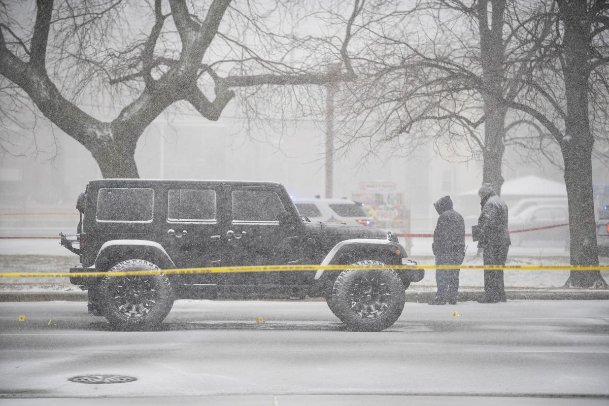 Officials investigate after an off-duty Chicago police officer was shot in his lower abdomen in the 8900 block of South Stony Island Avenue in Calumet Heights, Monday afternoon, March 15, 2021. The 32-year-old officer was in his personal vehicle, stopped at a traffic light at 89th Street and Stony Island Avenue, when two gunmen came up and fired into his vehicle, police said at the time.