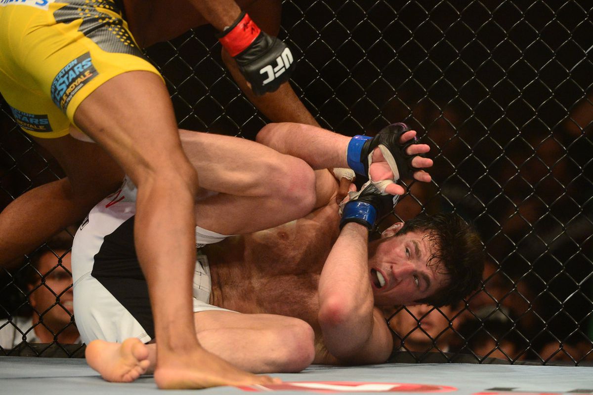 Jul. 7, 2012; Las Vegas, NV, USA; UFC fighter Chael Sonnen on the ground against Anderson Silva during a middleweight bout in UFC 148 at the MGM Grand Garden Arena. Mandatory Credit: Mark J. Rebilas-US PRESSWIRE