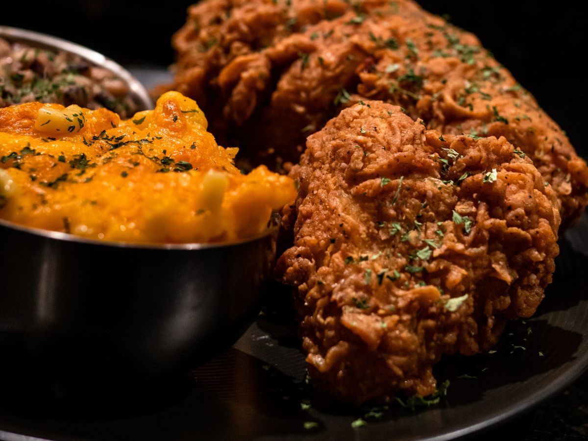 A plate of fried chicken and sides.