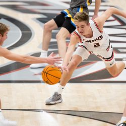 Orem’s Lance Reynolds and Alta’s Dylan Smith rush for a loose ball in a high school boys basketball game in Sandy on Tuesday, Jan. 4, 2022.