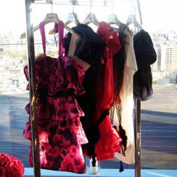 Floral dress, $199; one-shouldered eggplant dres, $199; pink ruffled dress, $199; t-shirt dress, $49.95; navy ruffled dress, $199