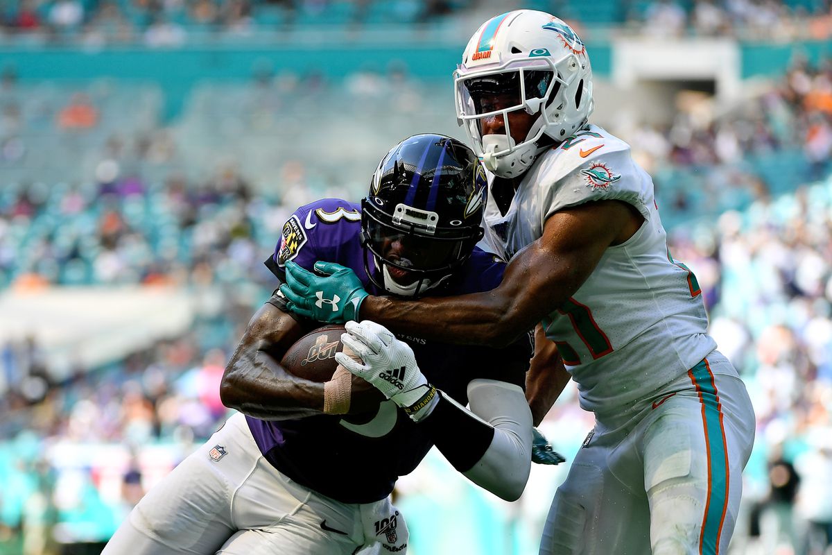 Miami Dolphins cornerback Eric Rowe wraps up Baltimore Ravens quarterback Robert Griffin III during the second half at Hard Rock Stadium.