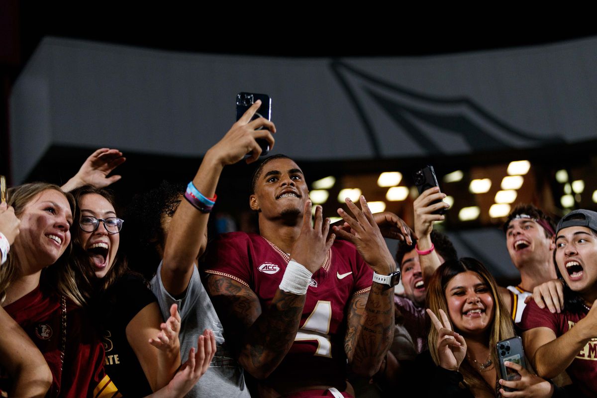 Florida State Seminoles wide receiver Keon Coleman celebrates the win against the North Alabama Lions with fans at Doak S. Campbell Stadium.&nbsp;