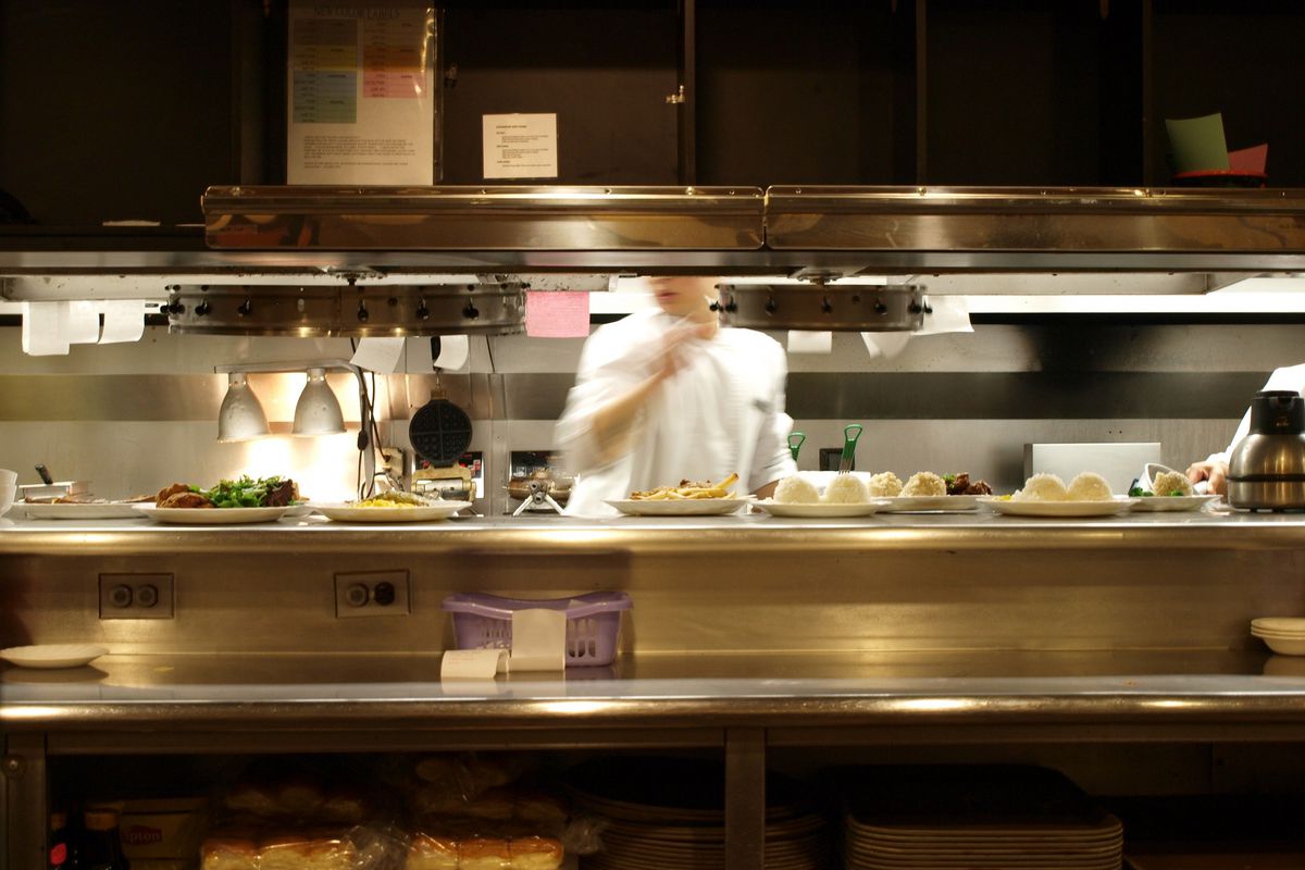 Stock photograph of a chef in a restaurant kitchen