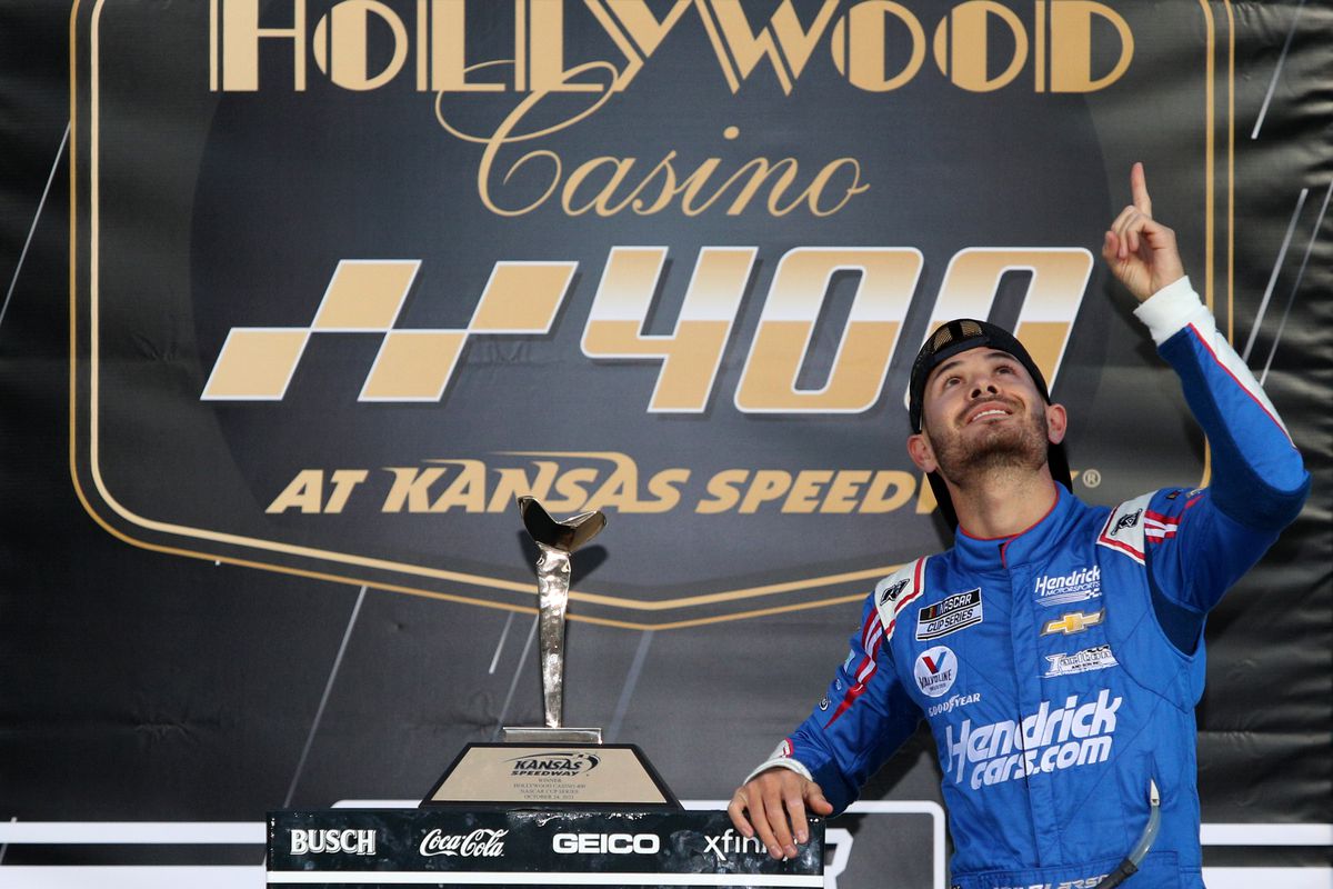 Kyle Larson, driver of the #5 HendrickCars.com Chevrolet, celebrates in the Ruoff Mortgage victory lane after winning the NASCAR Cup Series Hollywood Casino 400 at Kansas Speedway on October 24, 2021 in Kansas City, Kansas.