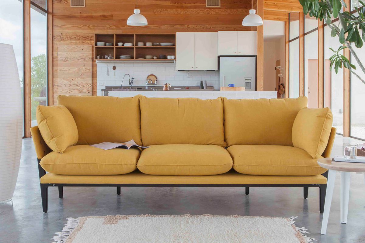 yellow three-seat sofa