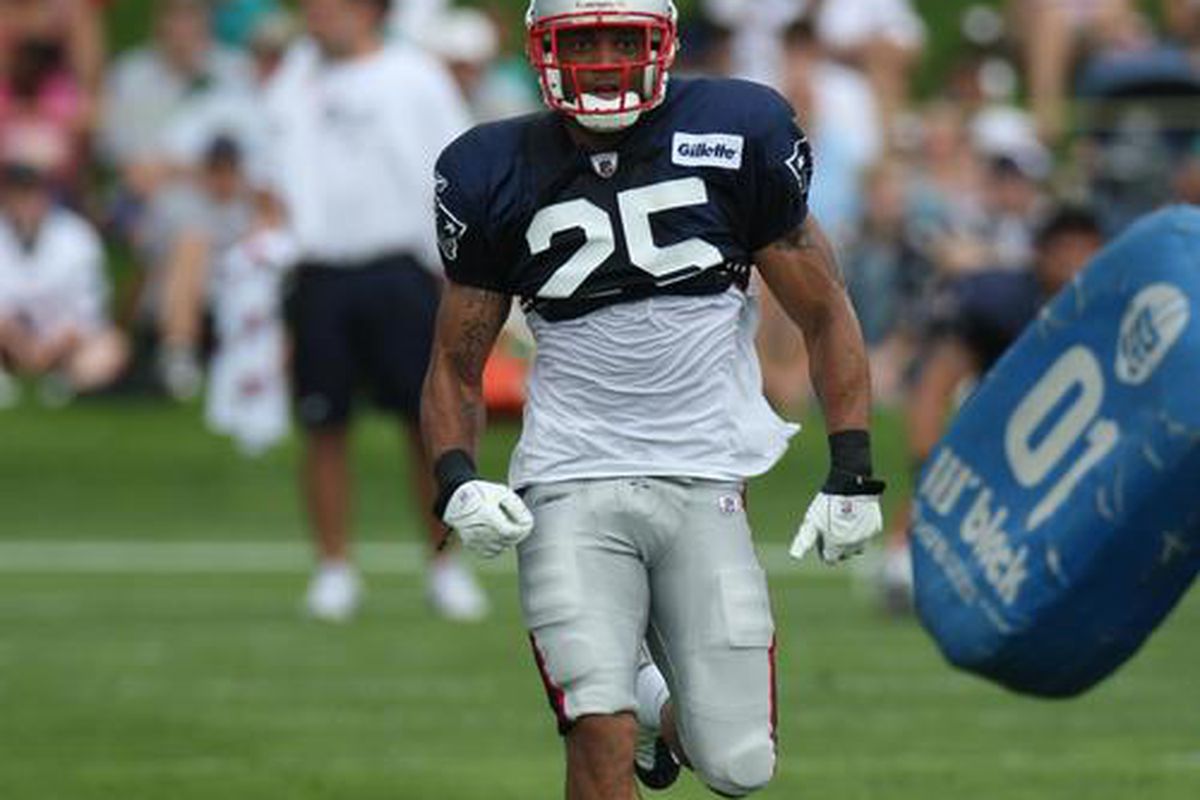 <em>Rookie S Patrick Chung runs through defensive back drills during the morning session at Gillette Stadium.</em>