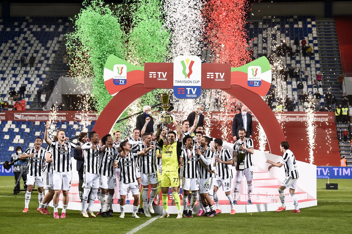 Gianluigi Buffon of Juventus FC lift the trophy as players