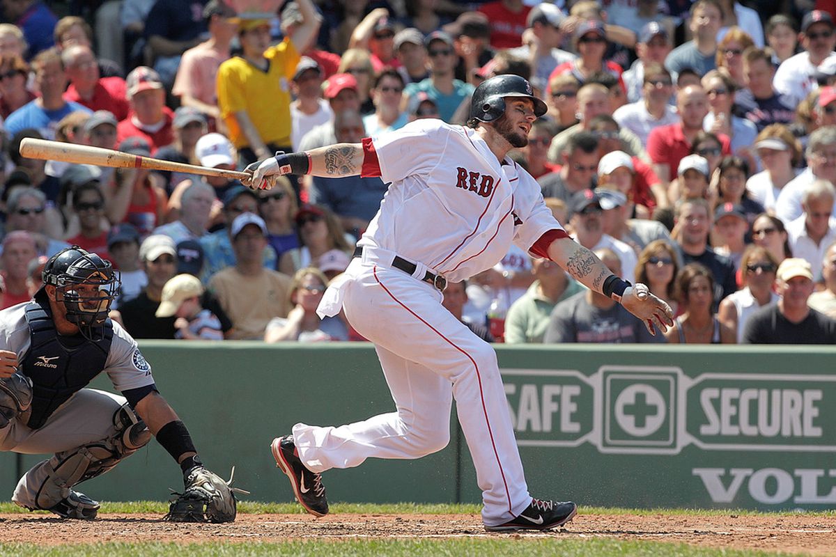 BOSTON, MA  - JULY 24:  Jarrod Saltalamacchia #39 of the Boston Red Sox makes contact during a game against the Seattle Mariners at Fenway Park on July 24, 2011 in Boston, Massachusetts.  (Photo by Jim Rogash/Getty Images)