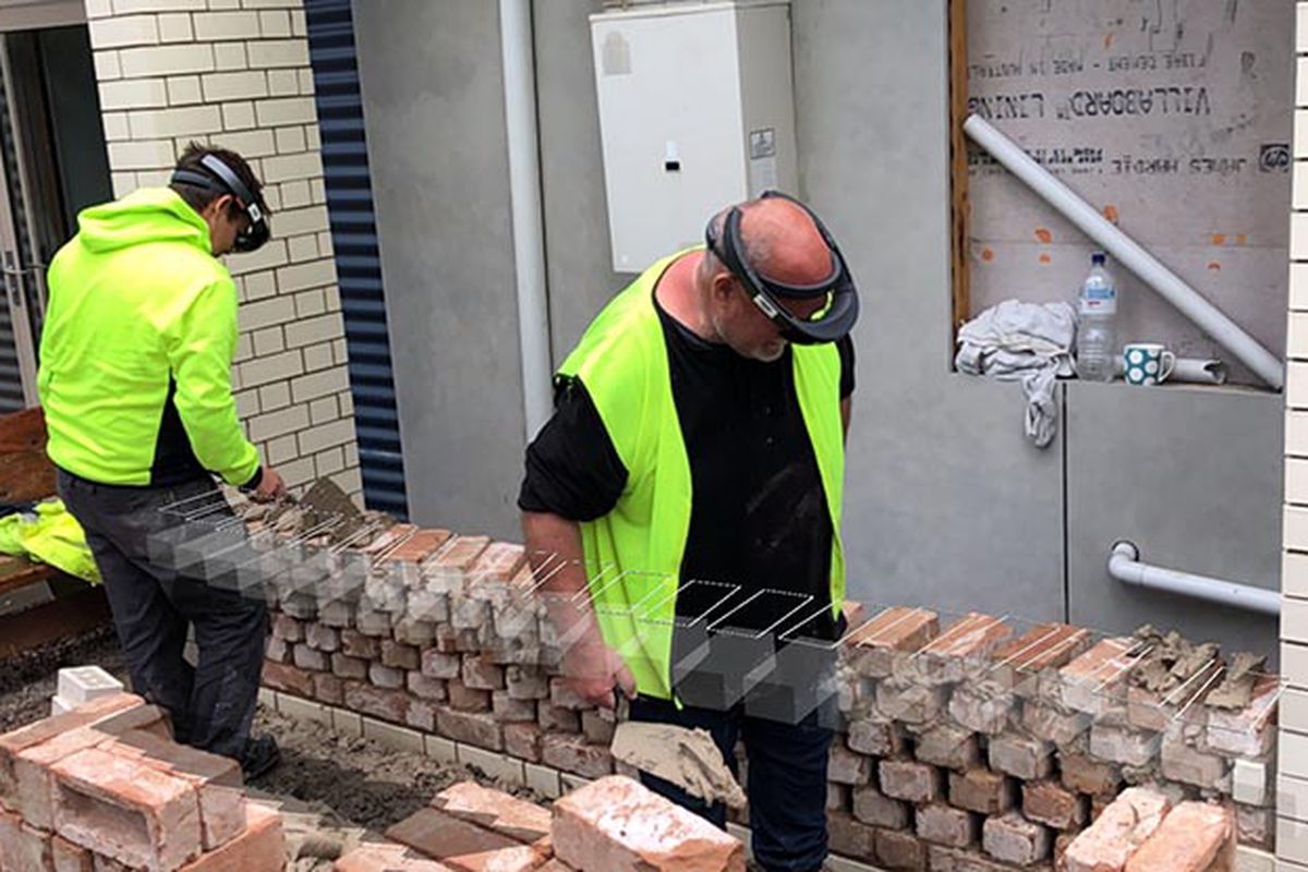 Bricklayers using augmented reality headset