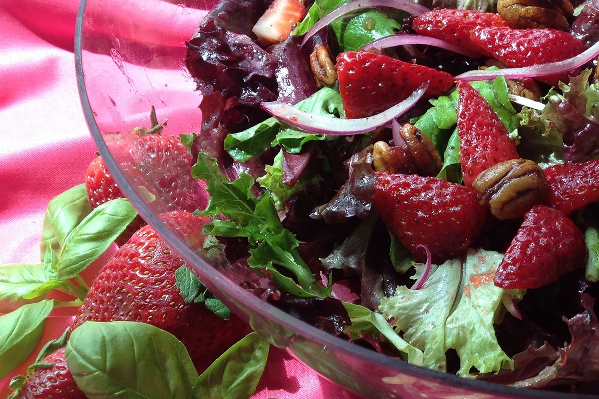 Strawberry baby greens salad with buttery spiced pecans and strawberry basil balsamic vinaigrette.