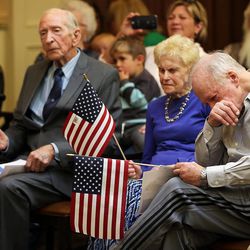 Veteran Brent Uibel gets emotional during a ceremony honoring veterans at Highland Glen Senior Living Center and Memory Care in Highland on Wednesday, Nov. 9, 2016. Behind him are Mildred Henry, wife of a veteran, and veteran Bill Bowman.