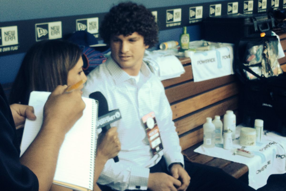 Grant Holmes talks with Alanna Rizzo of SportsNet LA and other reporters on Monday at Dodger Stadium.