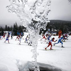 Athletes ski past an icicle during the women's 30k mass start classic race at the Vancouver 2010 Olympics in Whistler, British Columbia, Saturday. 