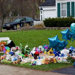 Mourners left balloons, stuffed animals and other items outside the home in Crystal Lake where Andrew “AJ” Freund lived. Reported missing last week, Andrew’s body was found Wednesday and his parents were charged with murder. | Matthew Hendrickson/Sun-Times