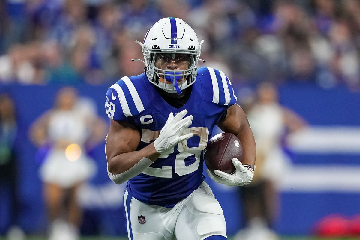 INDIANAPOLIS, INDIANA - OCTOBER 30: Jonathan Taylor #28 of the Indianapolis Colts runs with the ball in the third quarter against the Washington Commanders at Lucas Oil Stadium on October 30, 2022 in Indianapolis, Indiana.