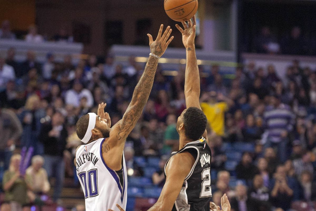 Tim Duncan controls the opening tip against the Sacramento Kings.