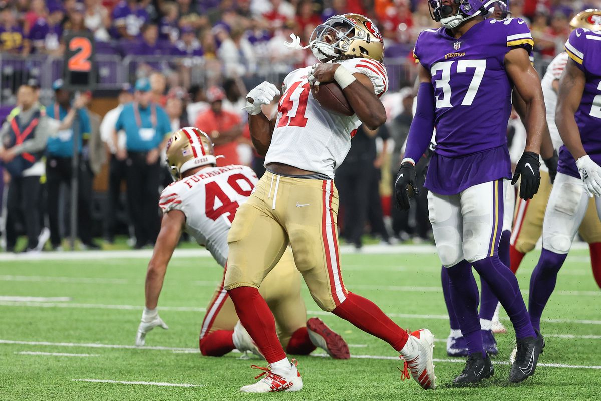 San Francisco 49ers running back Jordan Mason (41) reacts after converting a first down during the fourth quarter against the Minnesota Vikings at U.S. Bank Stadium.