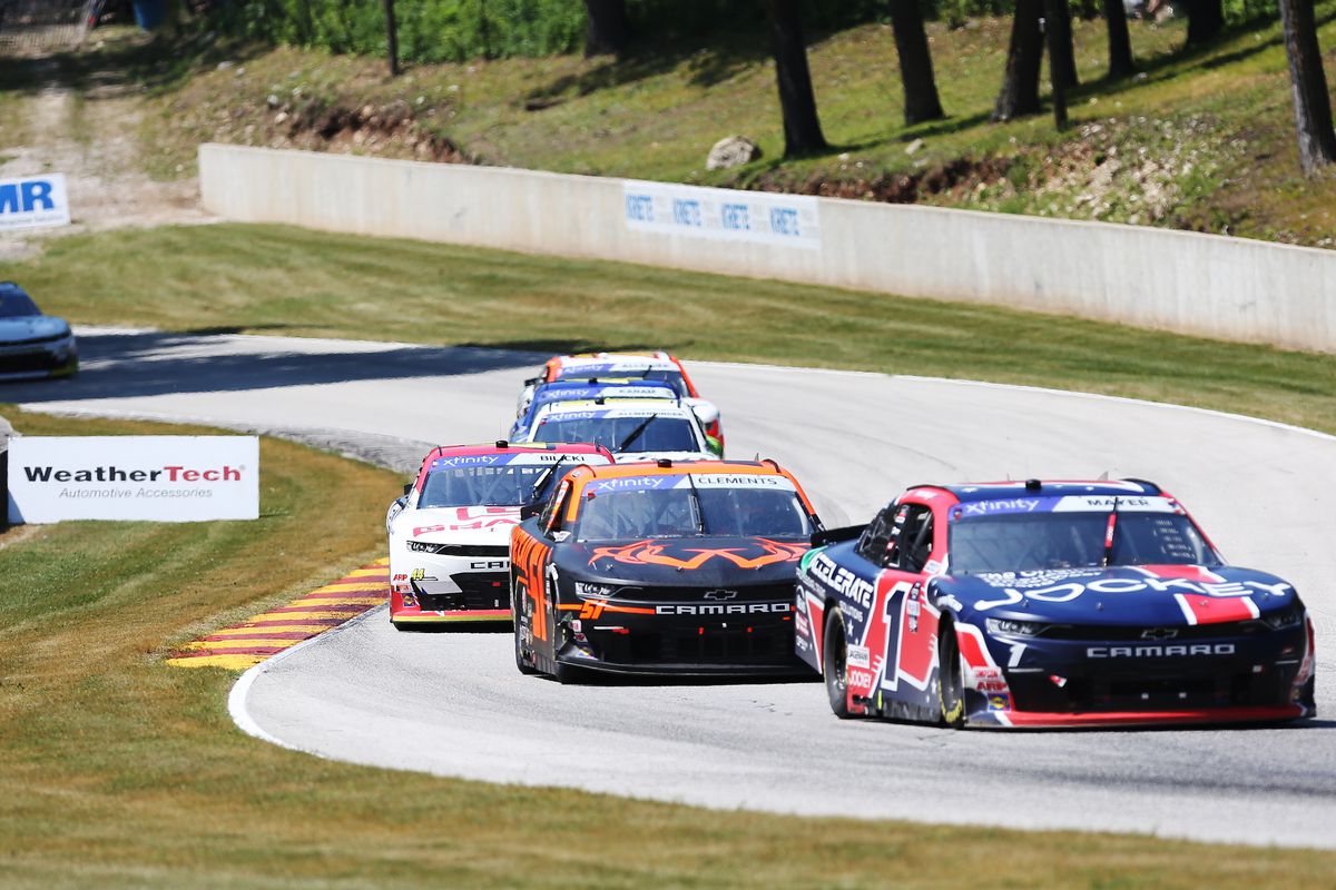 NASCAR Xfinity Series driver Sam Mayer )1) leads a pack of cars up a hill during the Henry 180 NASCAR Xfinity Series race on July 2, 2022, at Road America in Elkhart Lake, WI.
