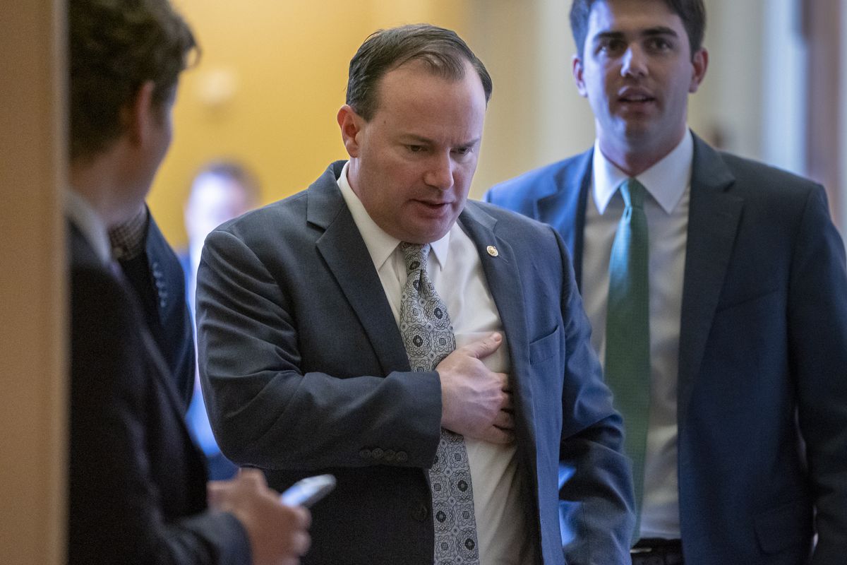 FILE - Sen. Mike Lee, R-Utah, leaves a Republican lunch meeting at the Capitol in Washington, Thursday, March 14, 2019. Lee says he's convinced President Donald Trump made the right call to scuttle an attack on Iran after talking to him Friday.