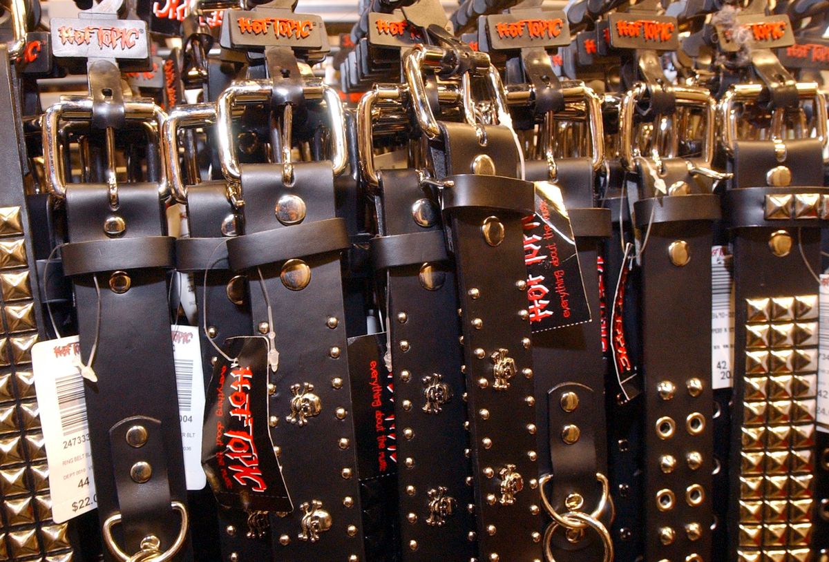 Hot Topic brand studded belts hang on a rack at a Hot Topic retail store&nbsp;