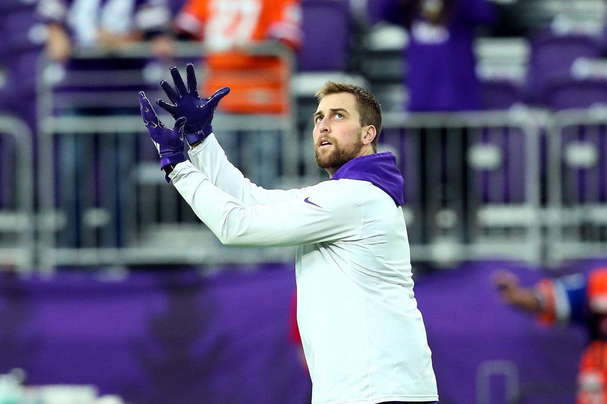 Adam Thielen of the Minnesota Vikings catches a football before a game against the Denver Broncos at U.S. Bank Stadium on November 17, 2019 in Minneapolis, Minnesota.