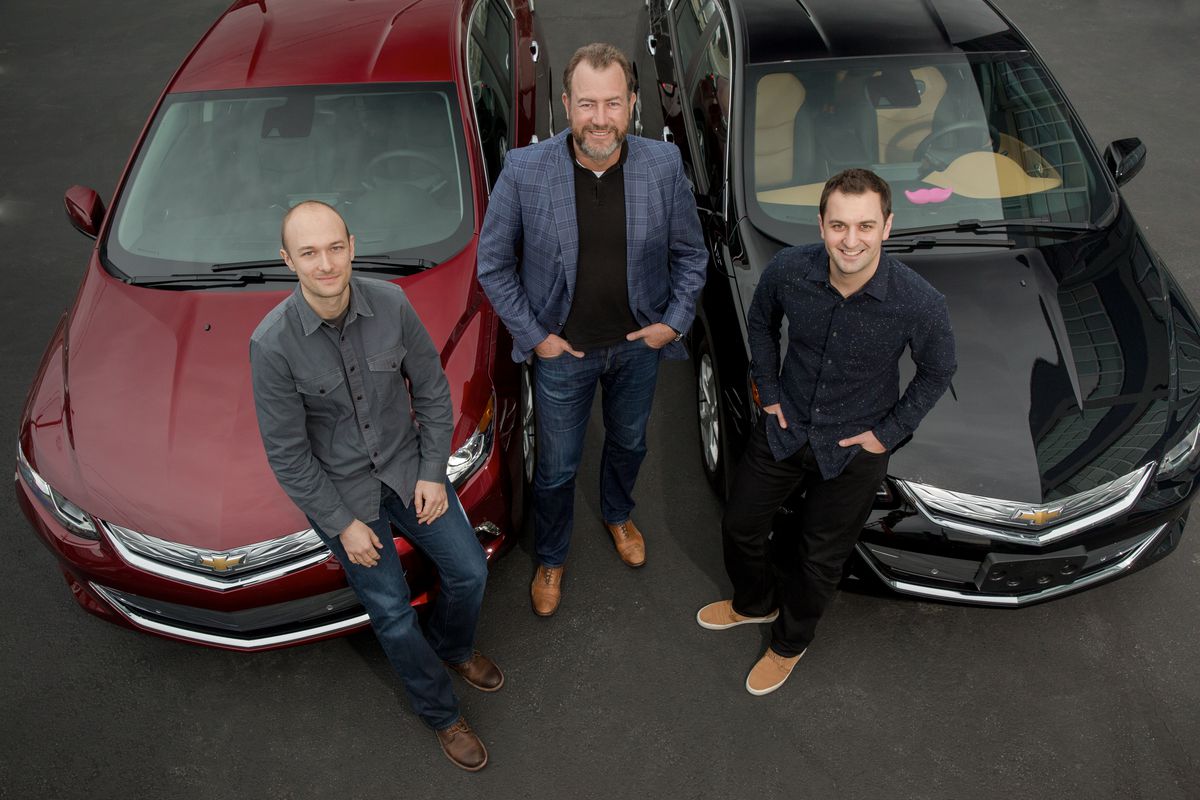 GM president Dan Ammann, center, with Lyft co-founders Logan Green and John Zimmer.