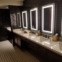 Old fashioned sinks and faucets in men’s room