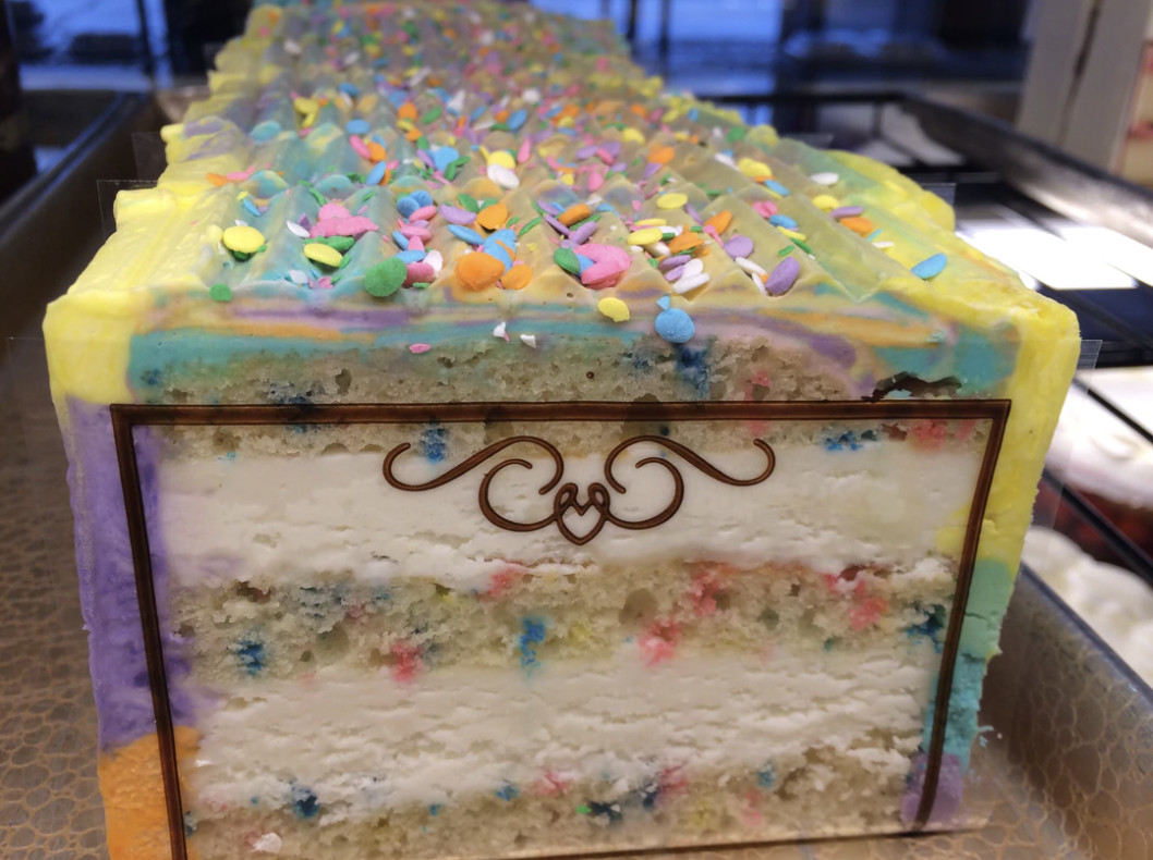 A long row of funfetti cake slices