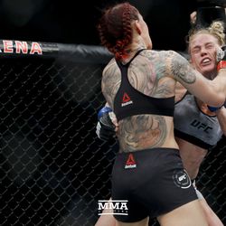 Cris Cyborg roughs up Holly Holm at UFC 219.