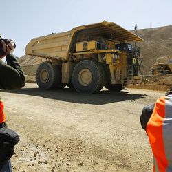 A haul truck carries up to 340 tons of material during a press tour at Kennecott's Bingham Canyon Mine on Thursday, April 25, 2013.