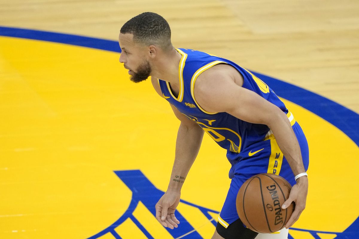 Stephen Curry of the Golden State Warriors dribbles the ball against the Dallas Mavericks during the first half of an NBA basketball game at Chase Center on April 27, 2021 in San Francisco, California.&nbsp;