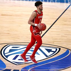 Utah Utes forward Timmy Allen (1) crosses midcourt as he brings the ball up as Utah and USC play in the Pac-12 Tournament at T-Mobile Arena in Las Vegas on Thursday, March 11, 2021. USC won 91-85 in double overtime.