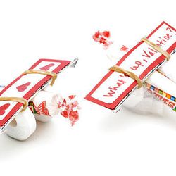 Kid's crafts you can make for Valentine's Day include these candy airplanes.