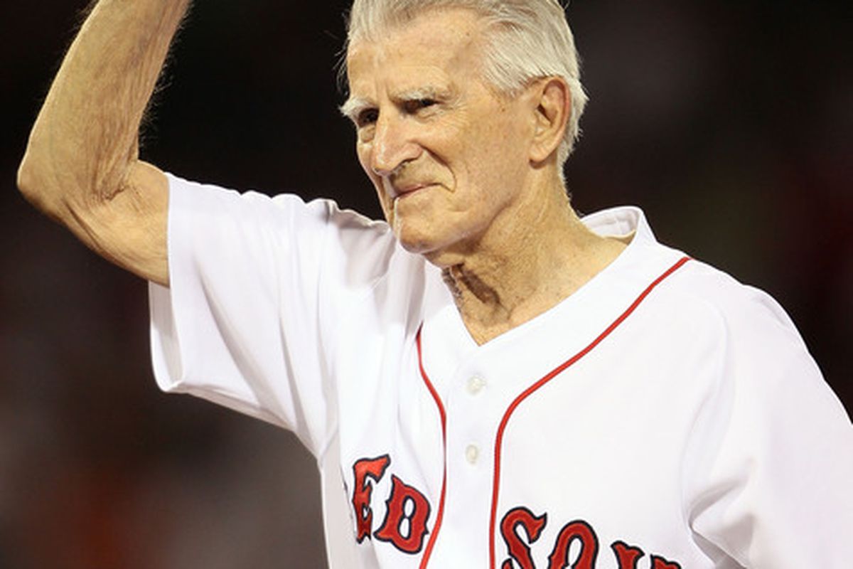 BOSTON - APRIL 04:  Boston Red Sox legend Johnny Pesky salutes the fans before the game against the New York Yankees on April 4, 2010 during Opening Night at Fenway Park in Boston, Massachusetts.  (Photo by Elsa/Getty Images)