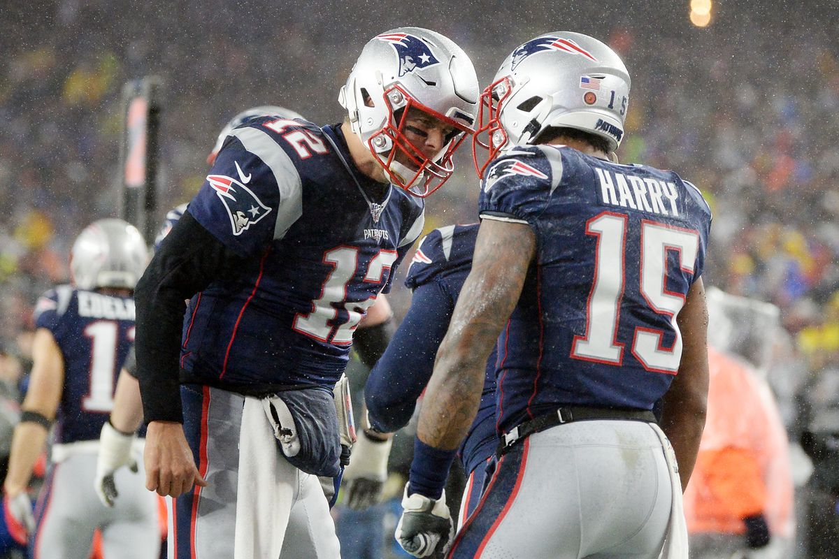 Tom Brady and N’Keal Harry of the New England Patriots celebrate after scoring a touchdown during the first quarter against the Dallas Cowboys in the game at Gillette Stadium on November 24, 2019 in Foxborough, Massachusetts.
