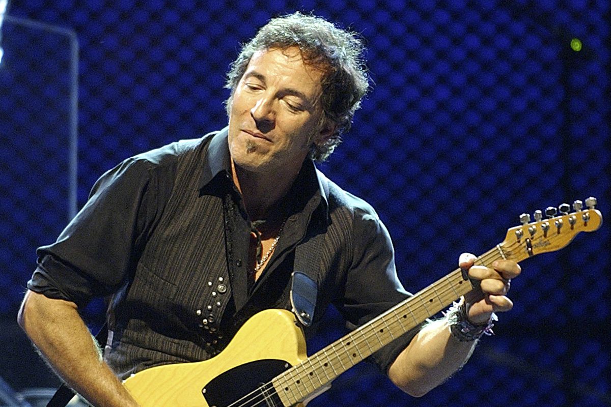 Bruce Springsteen performs with the E Street Band in 2003, at Fenway Park in Boston. 