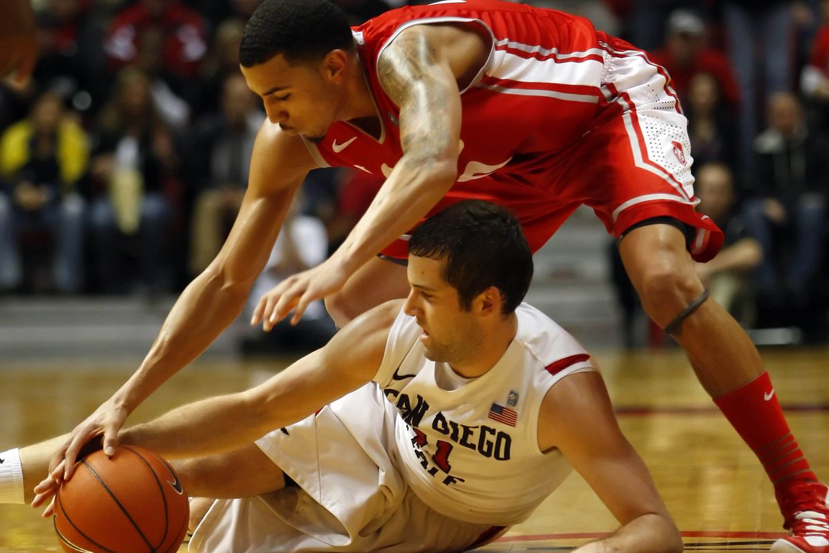 SDSU's James Rahon (bottom) and UNM's Kendall Williams (top) battle for the ball.